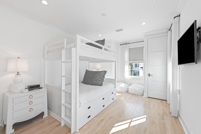 bedroom with light wood-type flooring