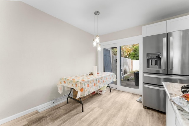 dining room with light hardwood / wood-style flooring