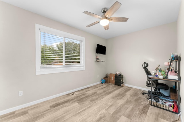 office area with ceiling fan and light wood-type flooring