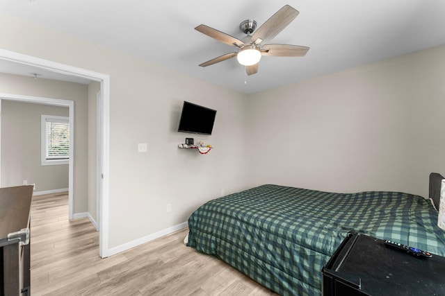 bedroom with light wood-type flooring and ceiling fan