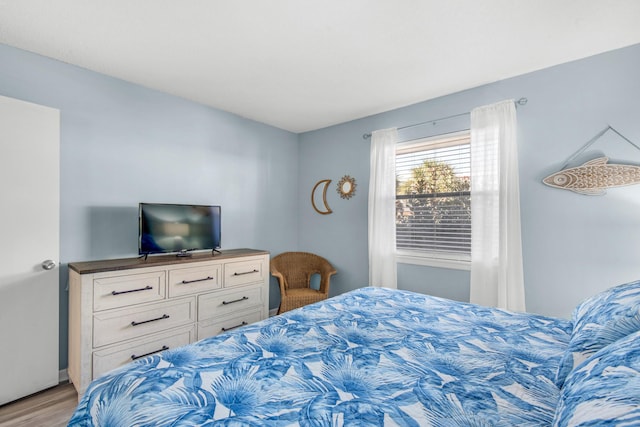 bedroom with light hardwood / wood-style floors