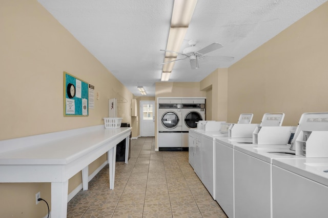 washroom with washer and dryer, ceiling fan, light tile patterned floors, and a textured ceiling