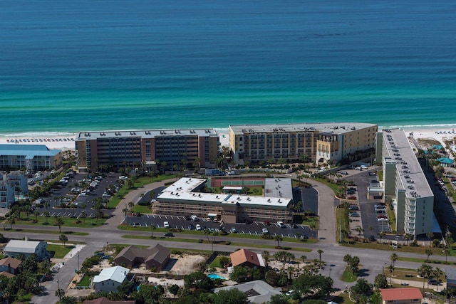 birds eye view of property with a beach view and a water view