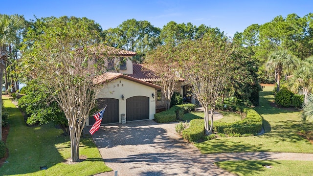 mediterranean / spanish house featuring a front lawn