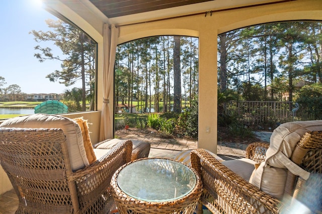 sunroom with a water view