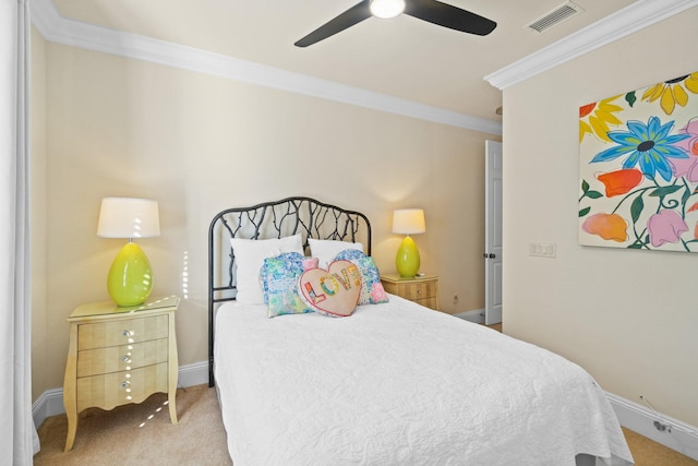 carpeted bedroom featuring ceiling fan and ornamental molding