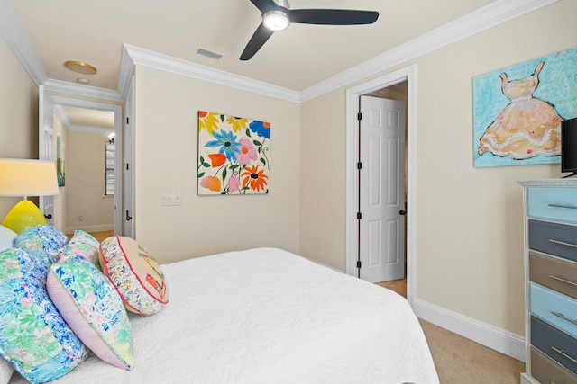 carpeted bedroom featuring ceiling fan and ornamental molding