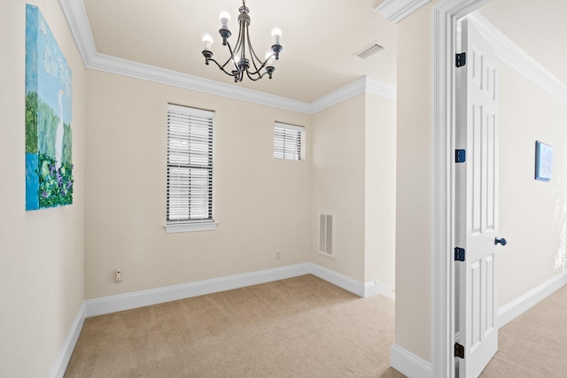 carpeted empty room with an inviting chandelier and crown molding