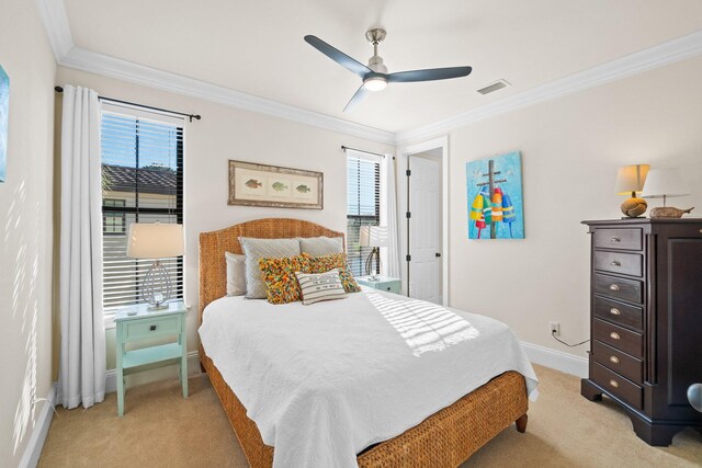 bedroom with ceiling fan, light colored carpet, and ornamental molding