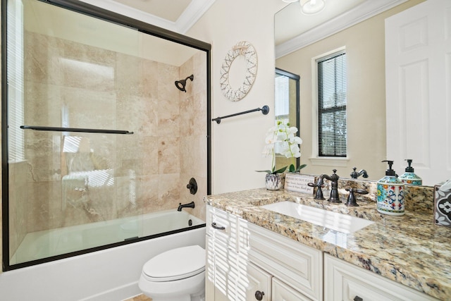 full bathroom with shower / bath combination with glass door, vanity, toilet, and crown molding