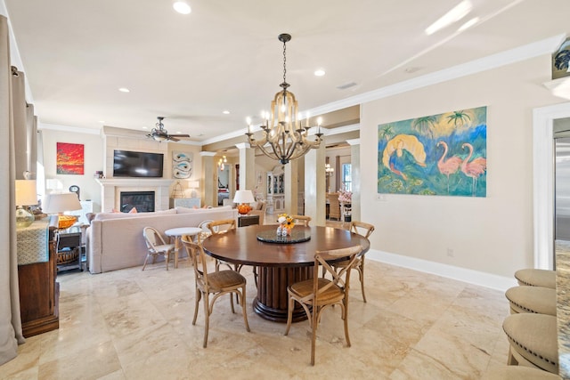 dining space featuring ceiling fan with notable chandelier and crown molding