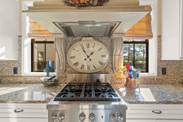 kitchen featuring backsplash and white cabinetry