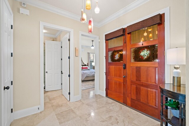 foyer entrance featuring crown molding