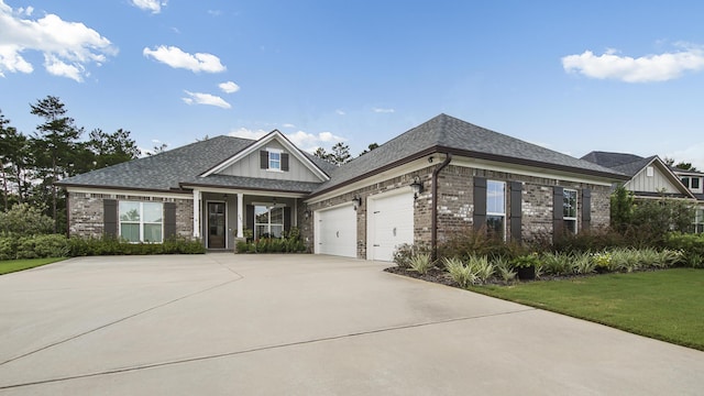 view of front facade featuring a garage and a front lawn