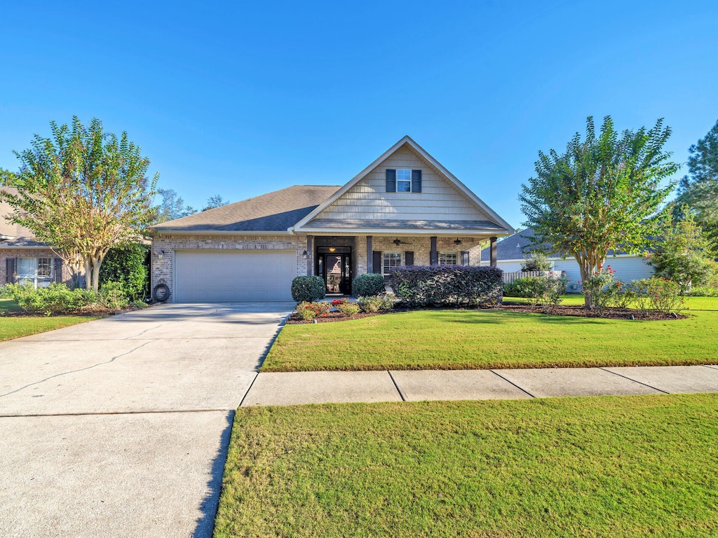 view of front facade with a garage and a front lawn