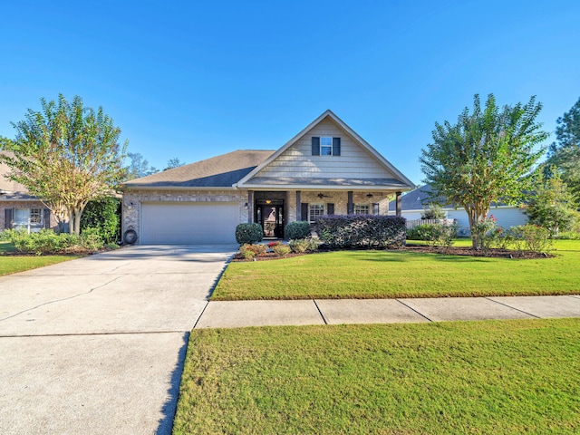 view of front facade with a garage and a front lawn