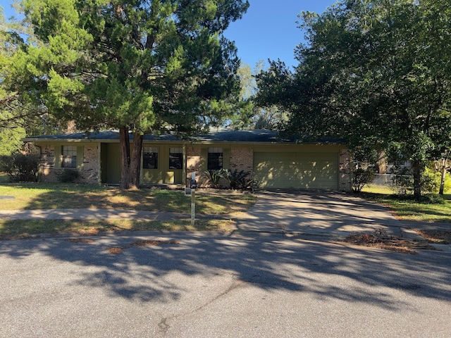 ranch-style house featuring a garage