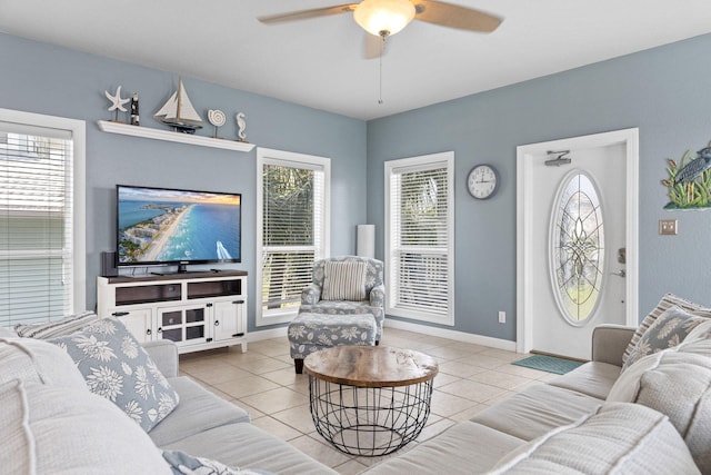 living room featuring light tile patterned floors and ceiling fan