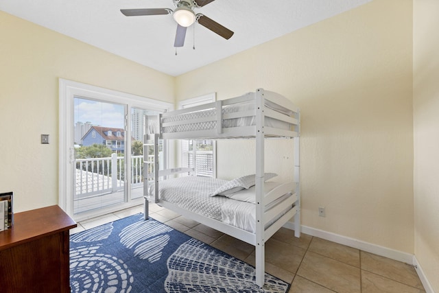 bedroom featuring ceiling fan, light tile patterned flooring, and access to outside