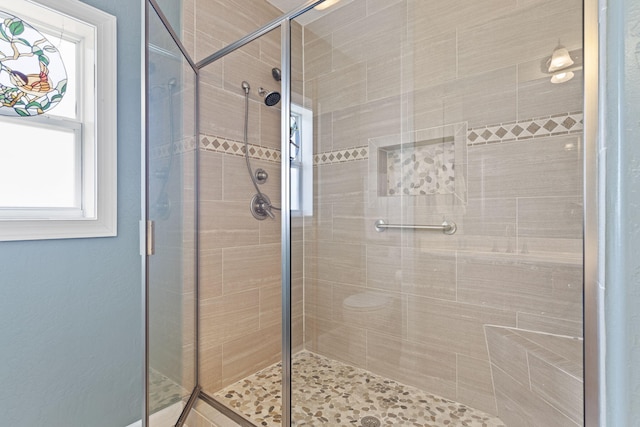 bathroom featuring an enclosed shower