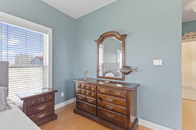 bedroom with light hardwood / wood-style floors