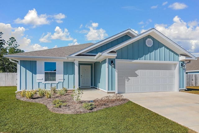 view of front of house with a garage and a front lawn