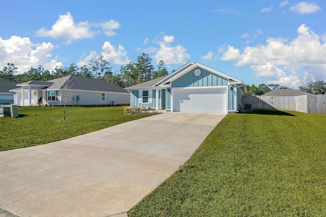 ranch-style home featuring a garage and a front lawn