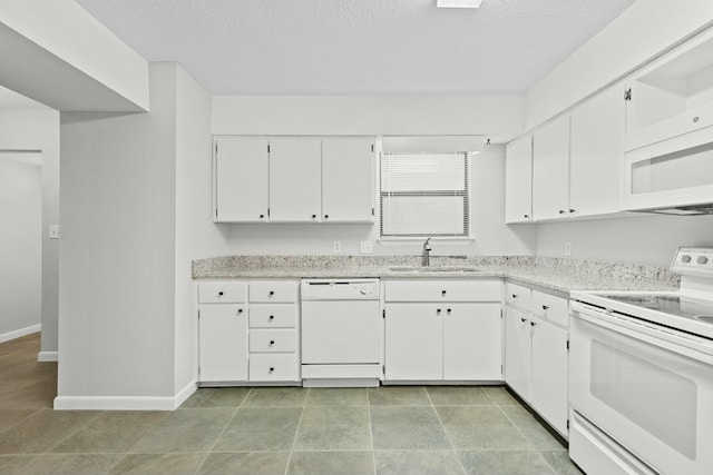 kitchen featuring white cabinetry, sink, and white appliances