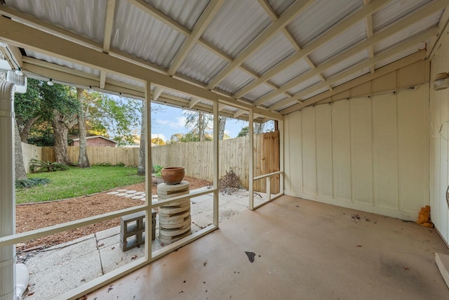 unfurnished sunroom with lofted ceiling