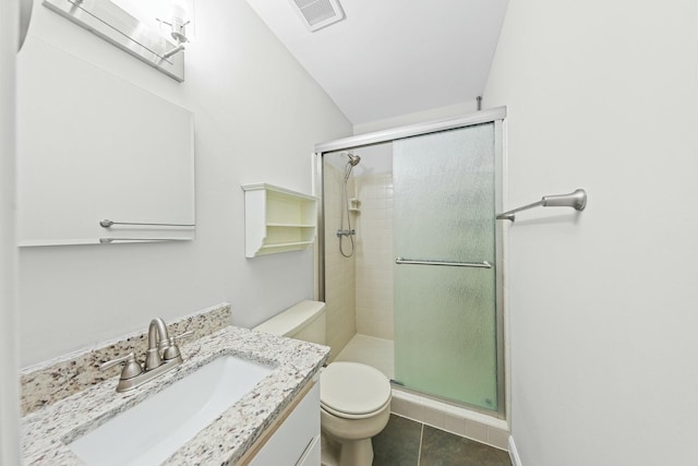 bathroom with tile patterned floors, vanity, toilet, and an enclosed shower