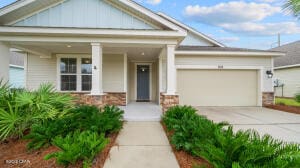 view of front of property with a garage and a porch