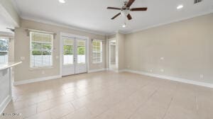 spare room with recessed lighting, french doors, baseboards, and crown molding