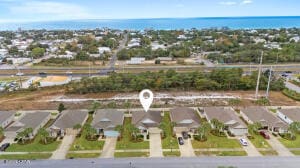 birds eye view of property with a residential view