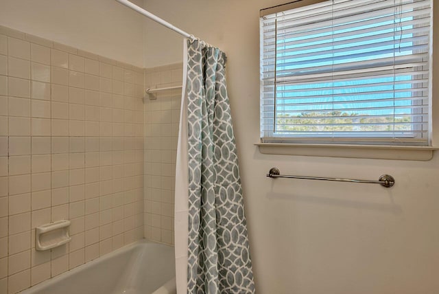 bathroom featuring shower / bath combination with curtain