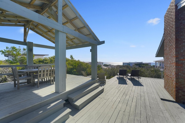 wooden deck with a water view