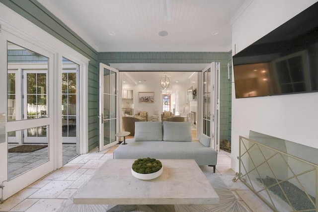 sunroom with an inviting chandelier