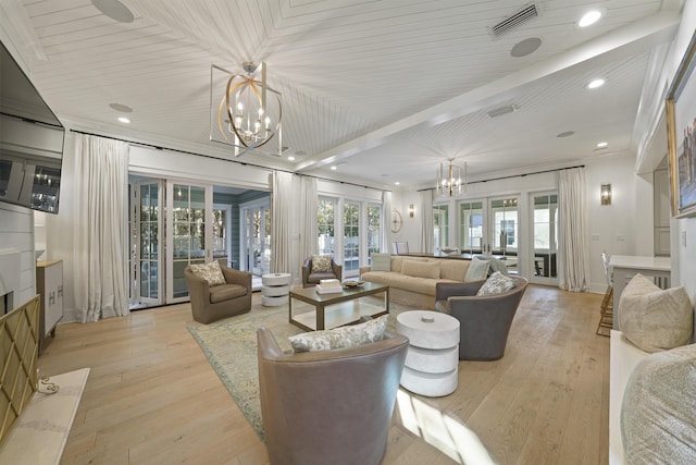 living room featuring beamed ceiling, a notable chandelier, light hardwood / wood-style floors, and wooden ceiling