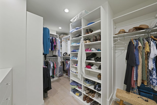 spacious closet featuring light hardwood / wood-style flooring