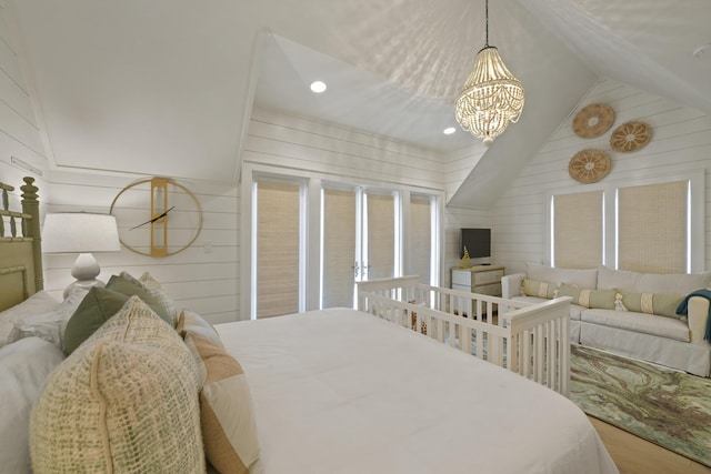 bedroom with a notable chandelier, wood-type flooring, wooden walls, and vaulted ceiling