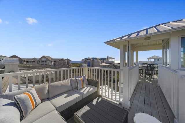 wooden deck featuring an outdoor hangout area