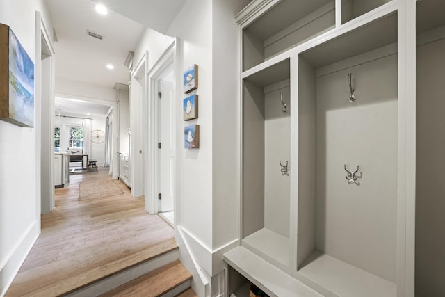 mudroom featuring recessed lighting, light wood-style flooring, and visible vents