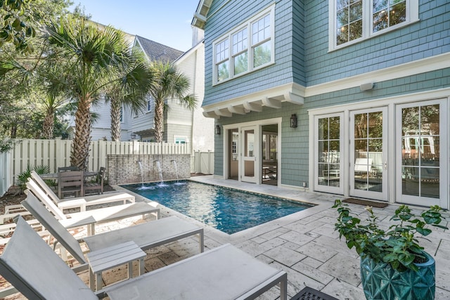 view of pool with a patio area, a fenced backyard, and a fenced in pool