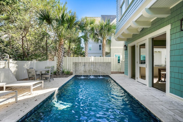 view of pool featuring a fenced in pool, a patio, a fenced backyard, and outdoor dining area