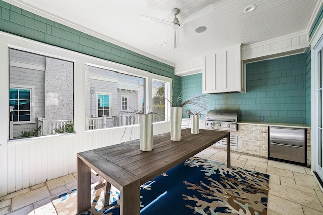 interior space featuring a grill, an outdoor kitchen, and ceiling fan