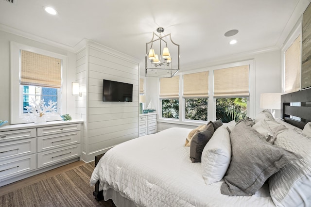 bedroom featuring crown molding, recessed lighting, a chandelier, and multiple windows