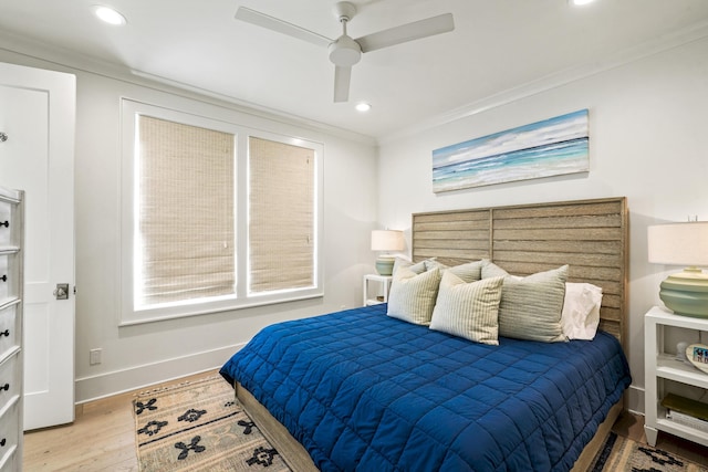 bedroom with a ceiling fan, crown molding, wood finished floors, baseboards, and recessed lighting