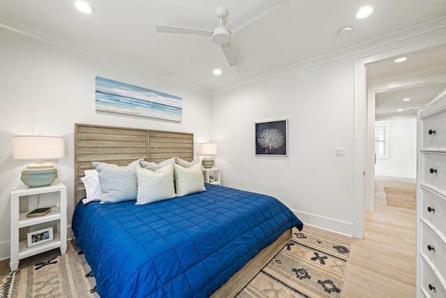 bedroom with wood finished floors, recessed lighting, and ornamental molding