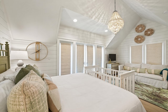 bedroom featuring wood finished floors, a chandelier, wood walls, lofted ceiling, and recessed lighting