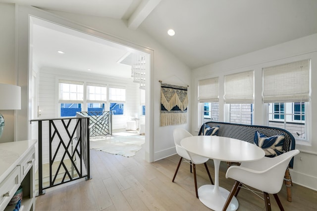 dining space with light wood finished floors, lofted ceiling with beams, baseboards, and recessed lighting