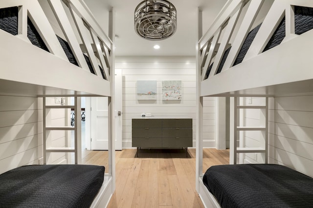 bedroom with hardwood / wood-style floors and recessed lighting